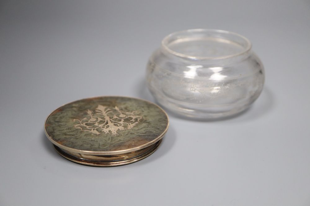 Three various tortoiseshell and silver pique-mounted glass toilet jars and a small silver circular box